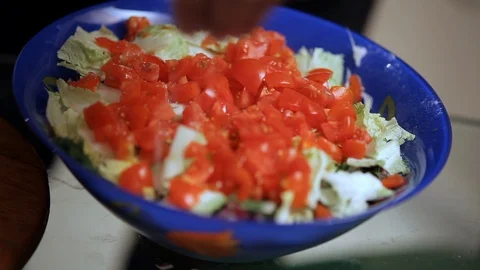 Salad sprinkled with salt Stock Footage 99791795
