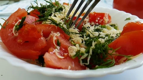Salad tomato dill cheese fork slow-motion shot Stock Footage 90033916