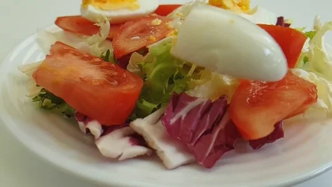 Salad tomato, egg falls, slow-motion shooting Stock Footage 87829947
