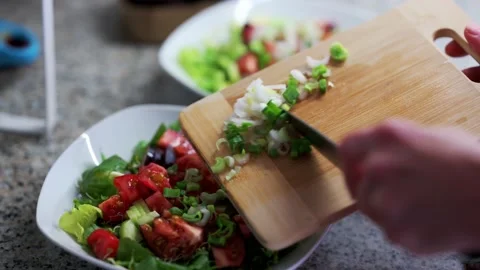 Salad with tomatoes, cucumbers, vegetables and green onions Stock Footage 200232395