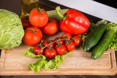 Salad vegetables on the cutting board Stock Photos