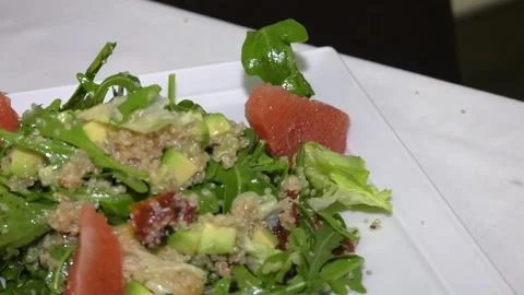 Salad was decorated with grapefruit slices Video stock 97750115