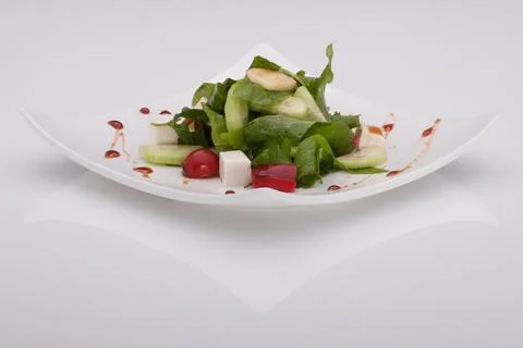 Salad in a white plate Fotos Stock