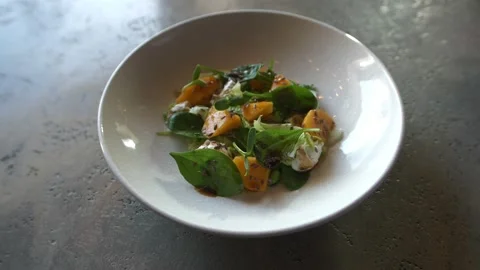 Salad of yellow tomatoes Stock Footage 168516024