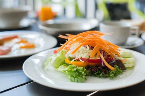 Salads vegetable breakfast served with eggs, ham, orange juice and delicious. Stock Photos