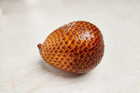 Salak fruit on a white table. Stock Photos