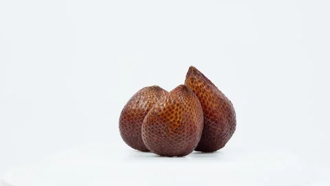 Salak Snake Fruit Rotating on White Background Isolated Stock Footage 325385754