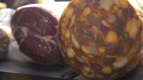 Salami and parma ham pieces in butcher store Stock Footage 111430809
