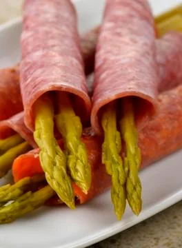 Salami with asparagus Stock Photos