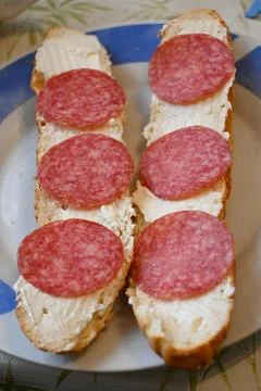 Salami bread rolls with sliced cured meat Stock Photos