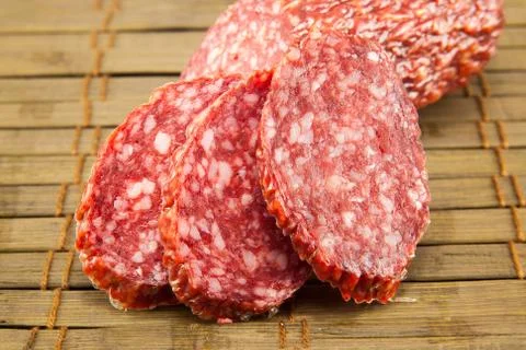 Salami isolated on a vintage background Stock Photos