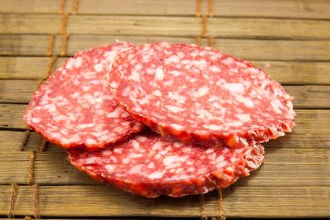 Salami isolated on a vintage background Stock Photos