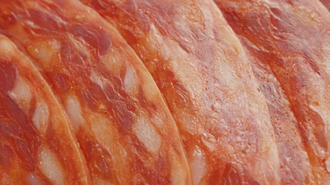 Salami meat slices macro close up presentation slowly rotating stock footage Stock Footage 344705178