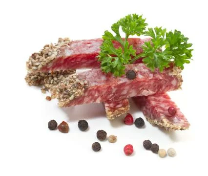 Salami with pepper on white background Stock Photos