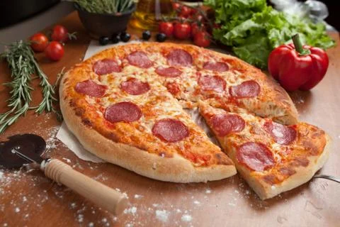 Salami pizza on the table Stock Photos