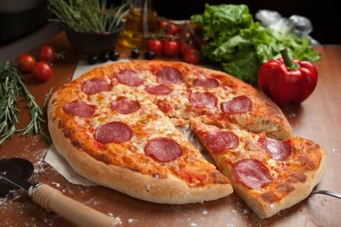 Salami pizza on the table Stock Photos