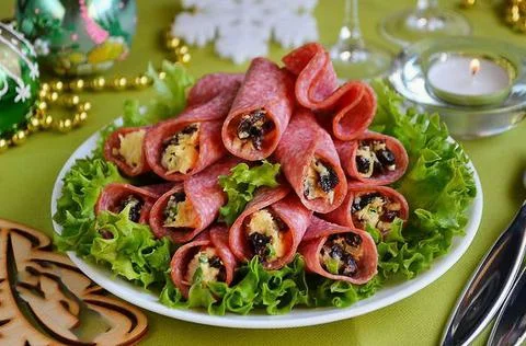 Salami rolls with prunes Stock Photos