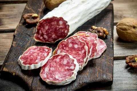 Salami with walnuts. Stock Photos