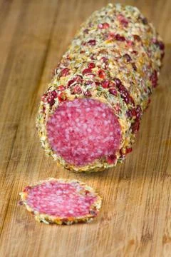 Salami on wood table 写真素材