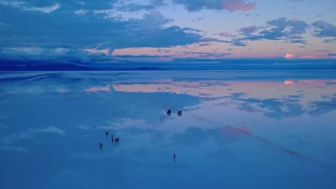 Salar de Uyuni Dusk Mirror Reflection With Travelers Bolivia 4K Stock Footage 332176599