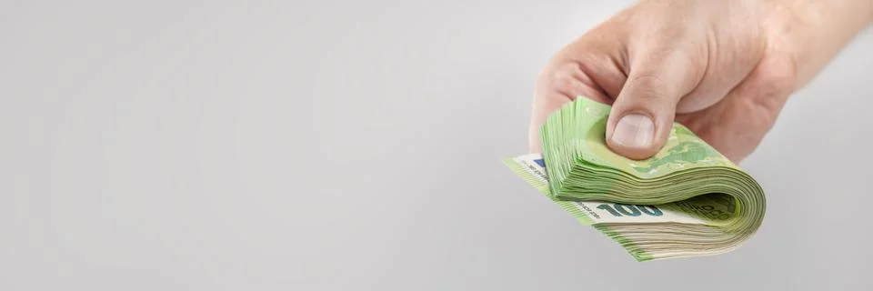 Salary in Europe. Increase or decrease of wages in the European Union. A man's 스톡 사진