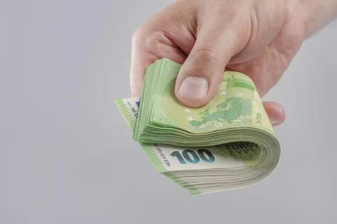 Salary in Europe. Increase or decrease of wages in the European Union. A man's 스톡 사진