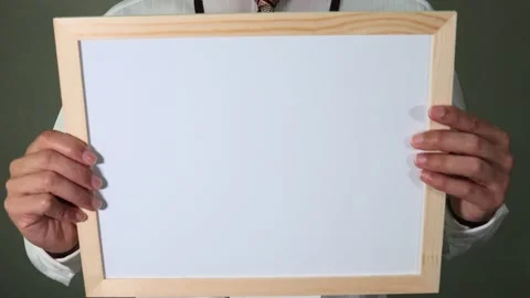 A salaryman holding a whiteboard 動画素材 336587148