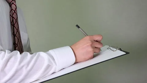 A salaryman writing on paper Video stock 336586716