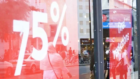 Sale 75 per centOff Sign On Store Window Display, Reflection Of pedestrians Stock Footage