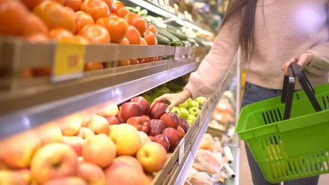 Sale, shopping, food, consumerism and people concept - woman with bag buying Stock Footage 87937983
