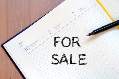 For sale write on notebook Stock Photos