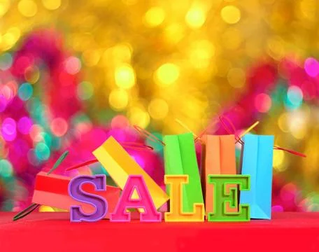 Sale written by colorful letters on the background of shopping bags Stock Photos
