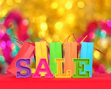 Sale written by colorful letters on the background of shopping bags Foto stock