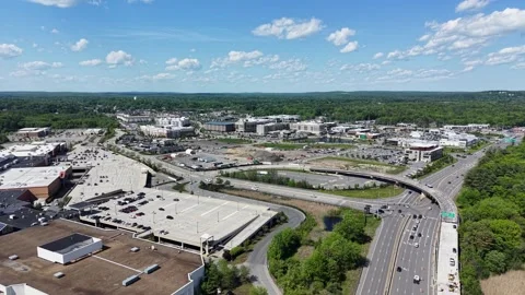 Salem retail complex sprawls beside highway roundabout and active construction Stock Footage 338417351