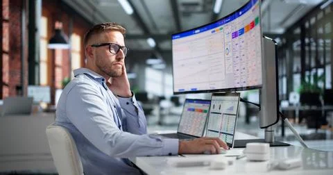 Sales Analyst Studies Customer Data On Laptop Using CRM Software Tools. Stock-Fotos