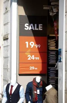 Sales is in front of the store. Stock Photos
