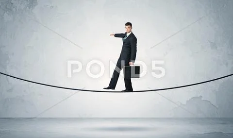 Sales guy balancing on tight rope Stock Photos