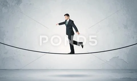Sales guy balancing on tight rope Stock Photos