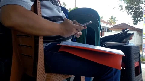 A sales man is using a smartphone for his work. Stock Footage 251506297