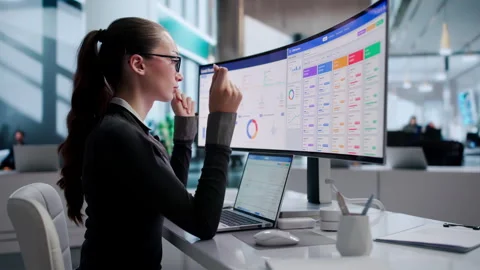Sales Manager Analyzes Customer Data Using CRM Software Stock Footage 343886615