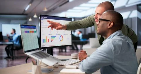 Sales Manager Analyzes Lead Scoring Dashboard To Improve Marketing Workflow. Stock Photos