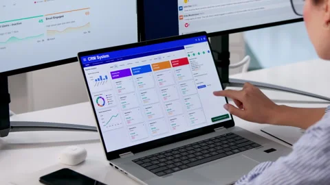 Sales Manager Analyzing CRM Software Data On Computer Stock Footage 333843867
