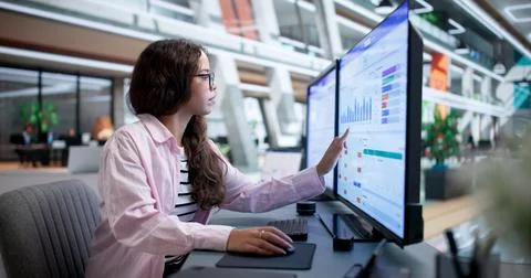 Sales Manager Analyzing Customer Data On Computer For Lead Tracking Success. Stock Photos