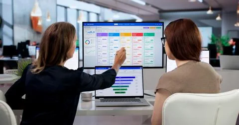 Sales Manager And Assistant Analyze Client Data To Boost Sales Growth. Foto stock