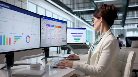 Sales Manager Carefully Tracking Customer Leads Using CRM Software Stock Footage 343881431