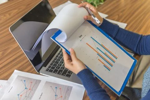 Sales manager checking sales reports in office Stock Photos