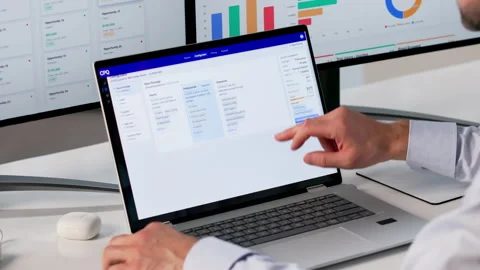 Sales Manager Configuring Pricing Software On Laptop Stock Footage 334931569