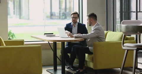 Sales manager makes offer to client during meeting in office Stock Footage 225207702