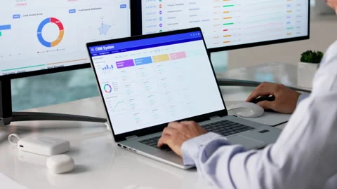 Sales Manager Reviewing Customer Data On Computer Stock Footage 335456174