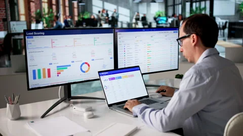 Sales Manager Reviewing Customer Data On Computer Stock Footage 335879378